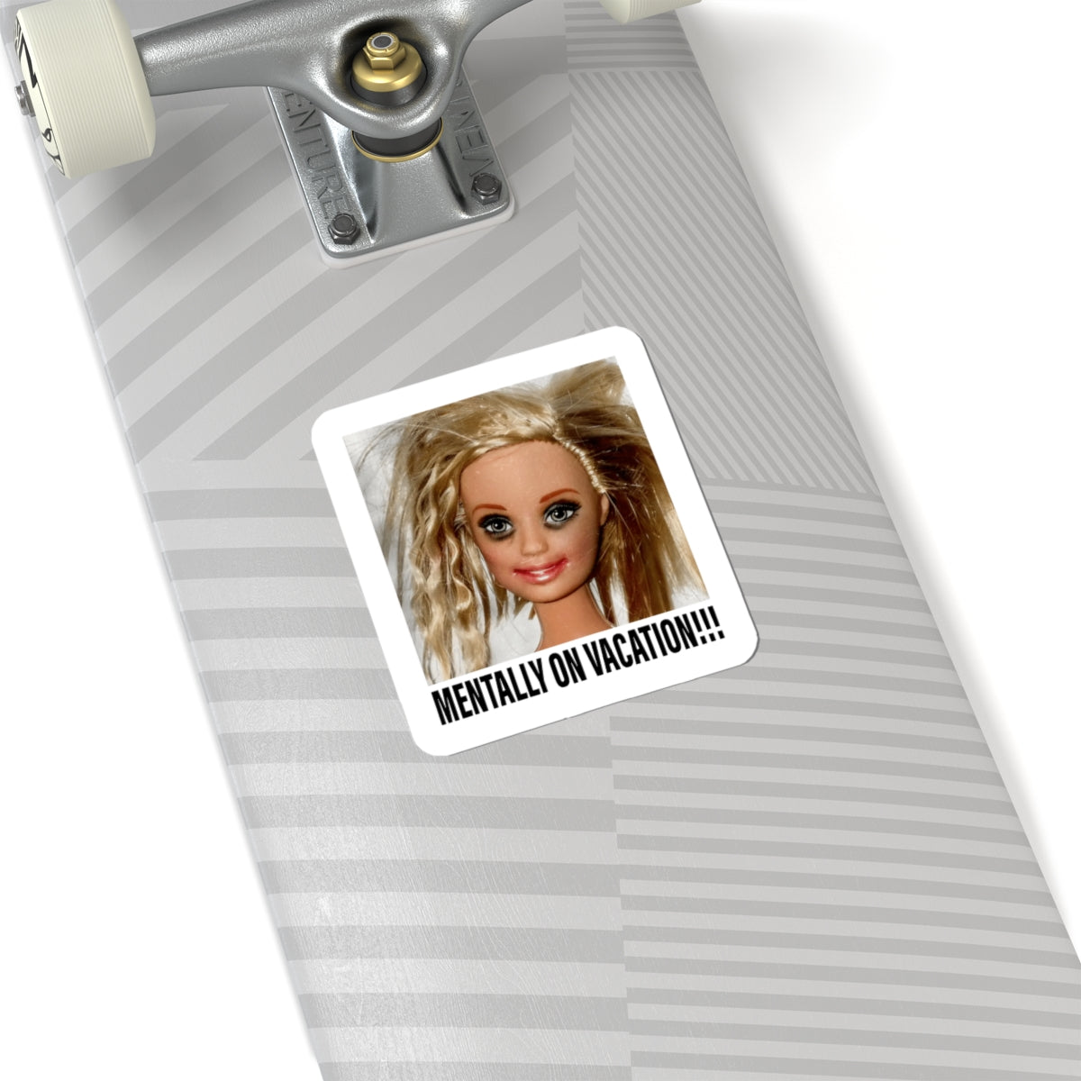 Mentally on Vacation sticker displayed on a skateboard