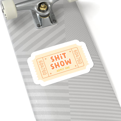 Cream colored shit show ticket on skateboard 