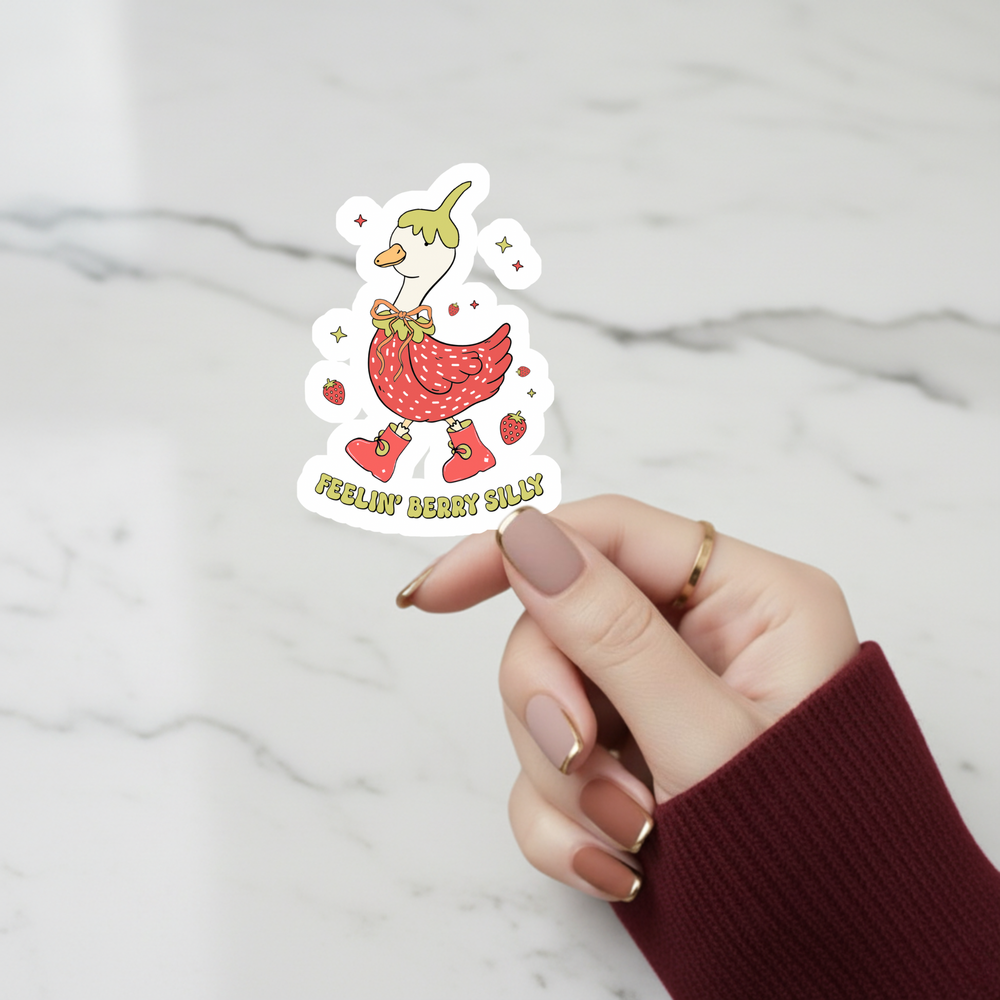 goose wearing strawberry outfit sticker