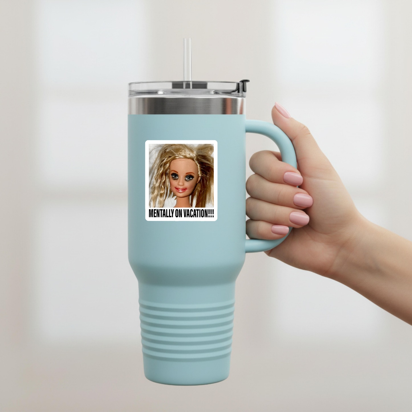 Blonde doll meme sticker on a 40-ounce tumbler